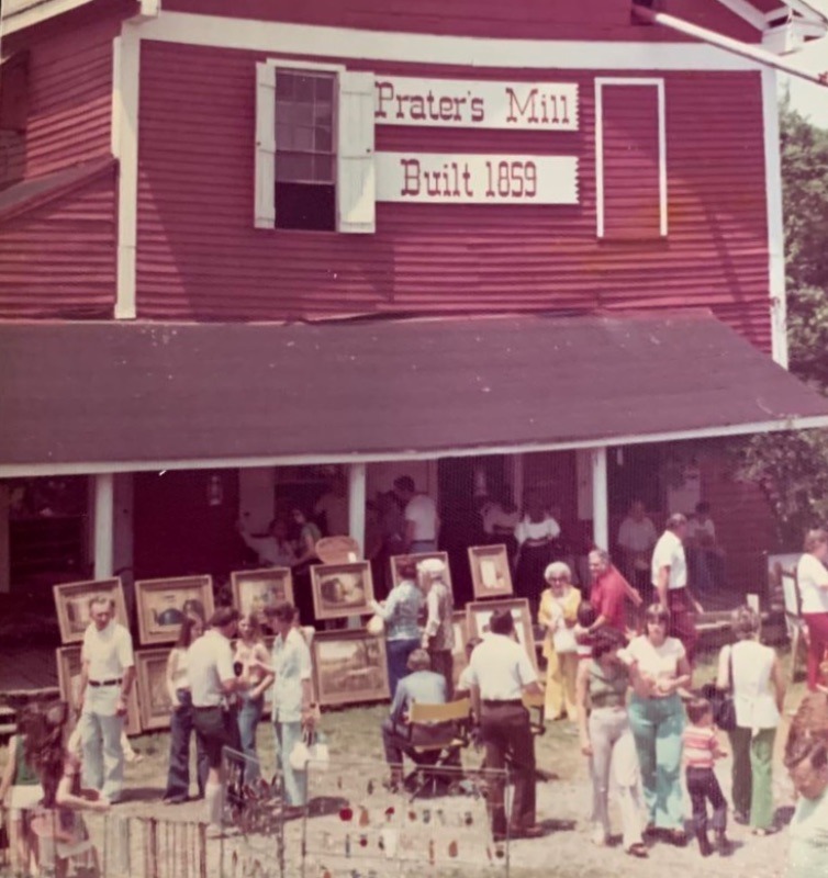late 1970s paintings displayed in front of the cleaned and painted Mill now the centerpiece of the event.